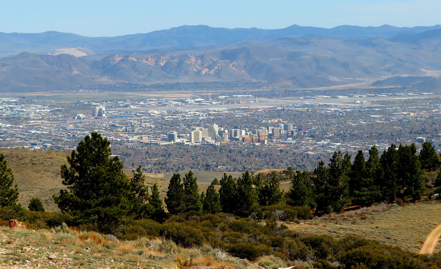 Downtown Reno in the distance from the surrounding Mountains